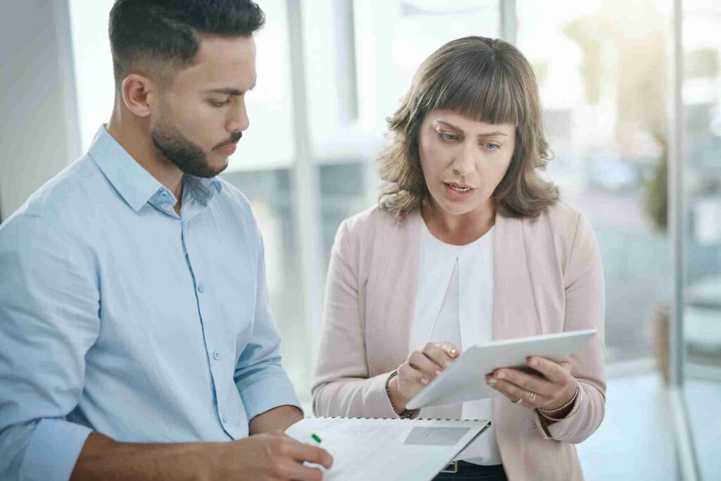 Advisor and client reviewing information on a tablet